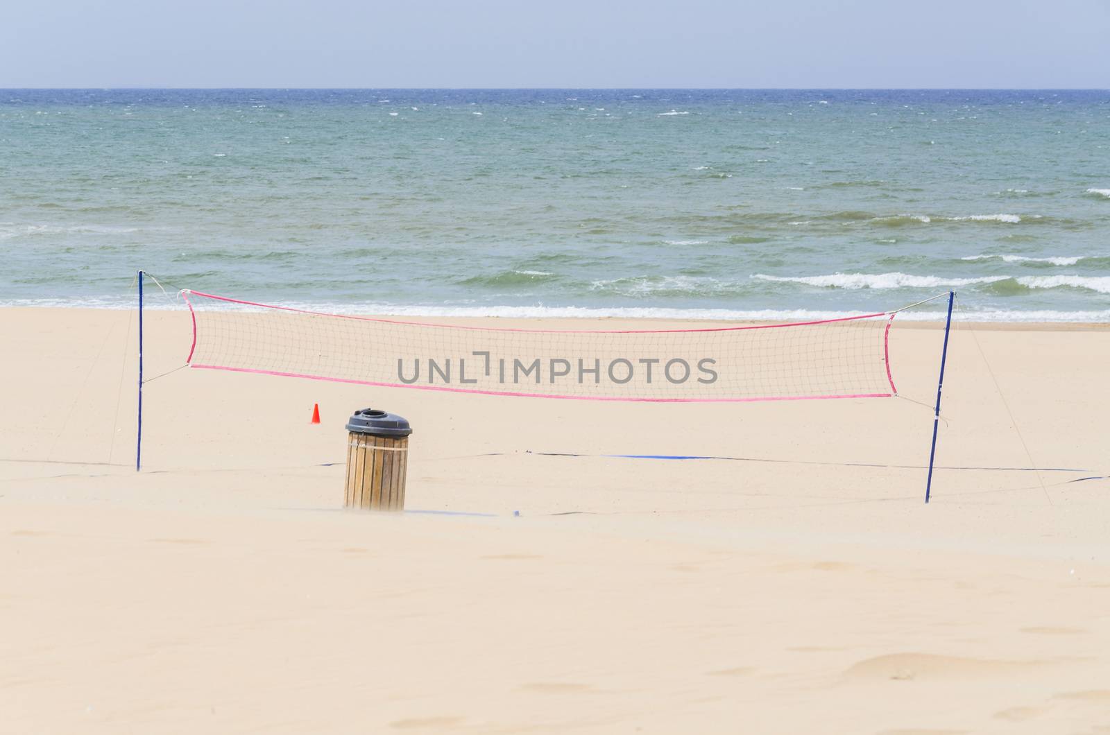  Deserted beach, volleyball net and dustbin by JFsPic