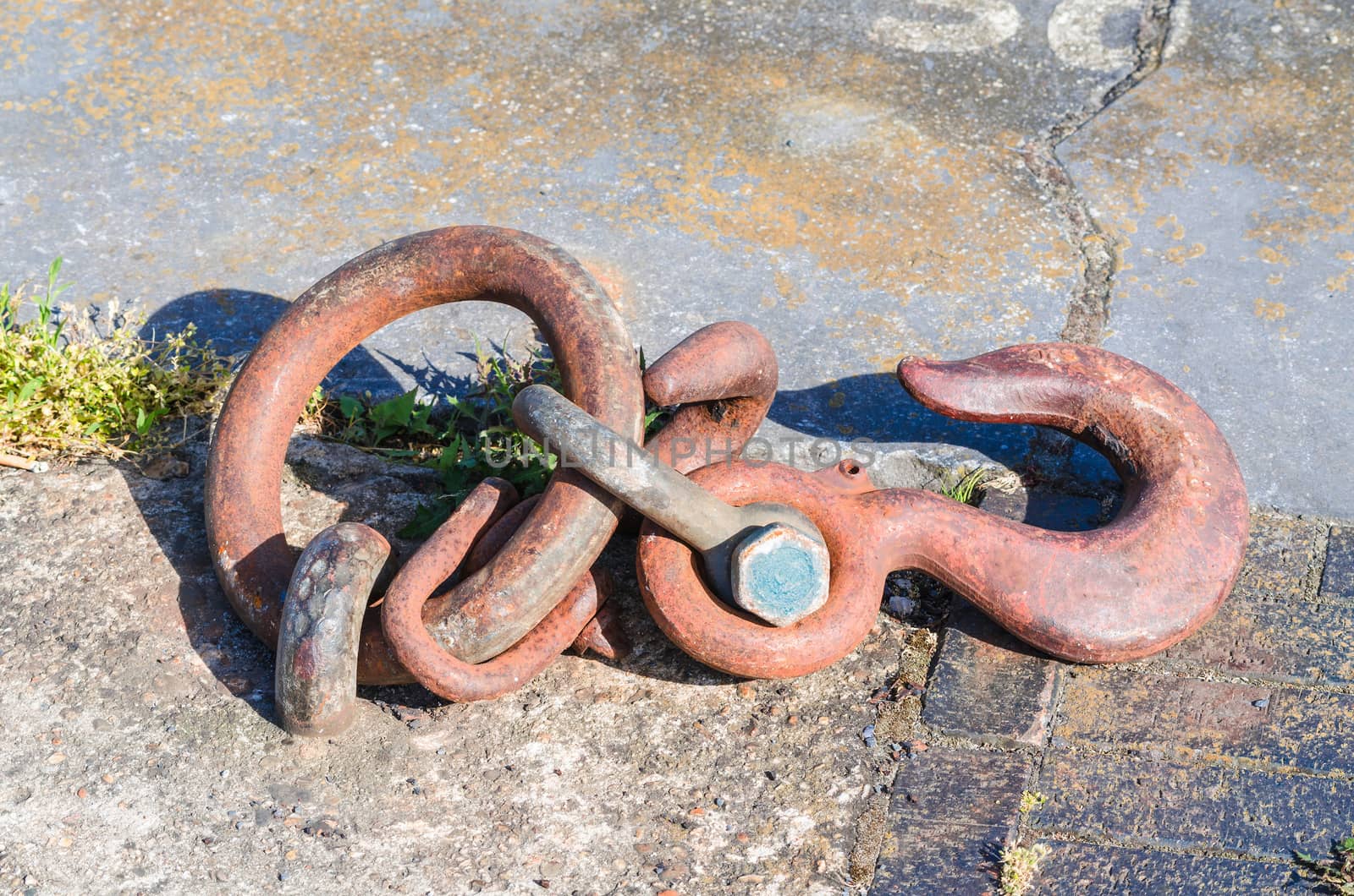 Mooring strap, steel hook and eye at a quay for securing larger motor ships.