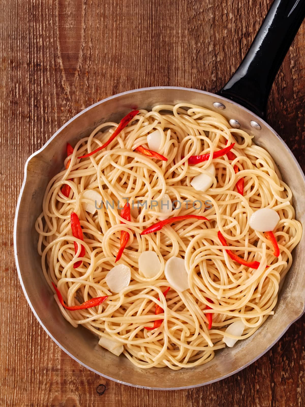 close up of rustic traditional italian aglio olio spaghetti pasta