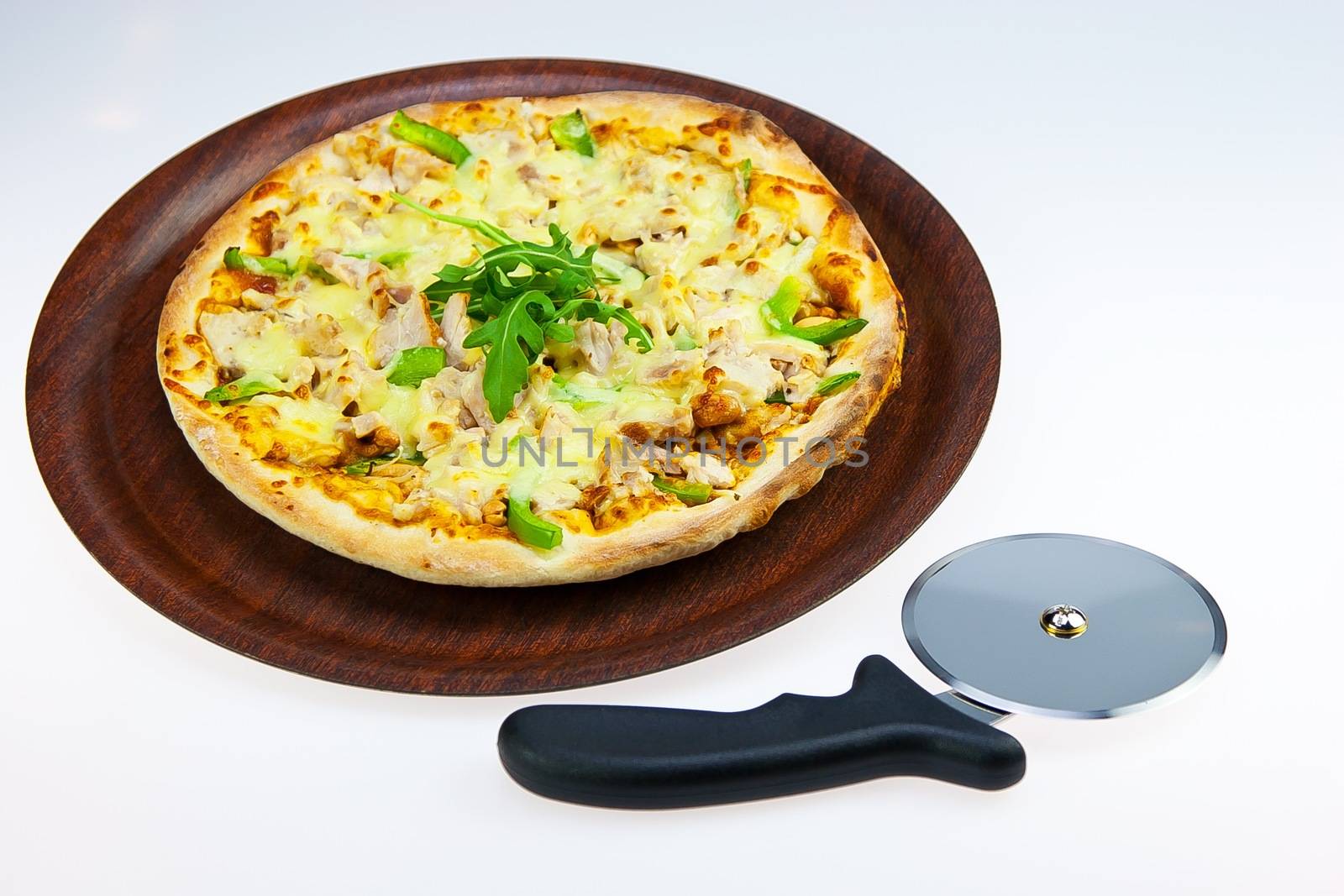 Chicken Pasta on Tray and Pizza Cutter on white