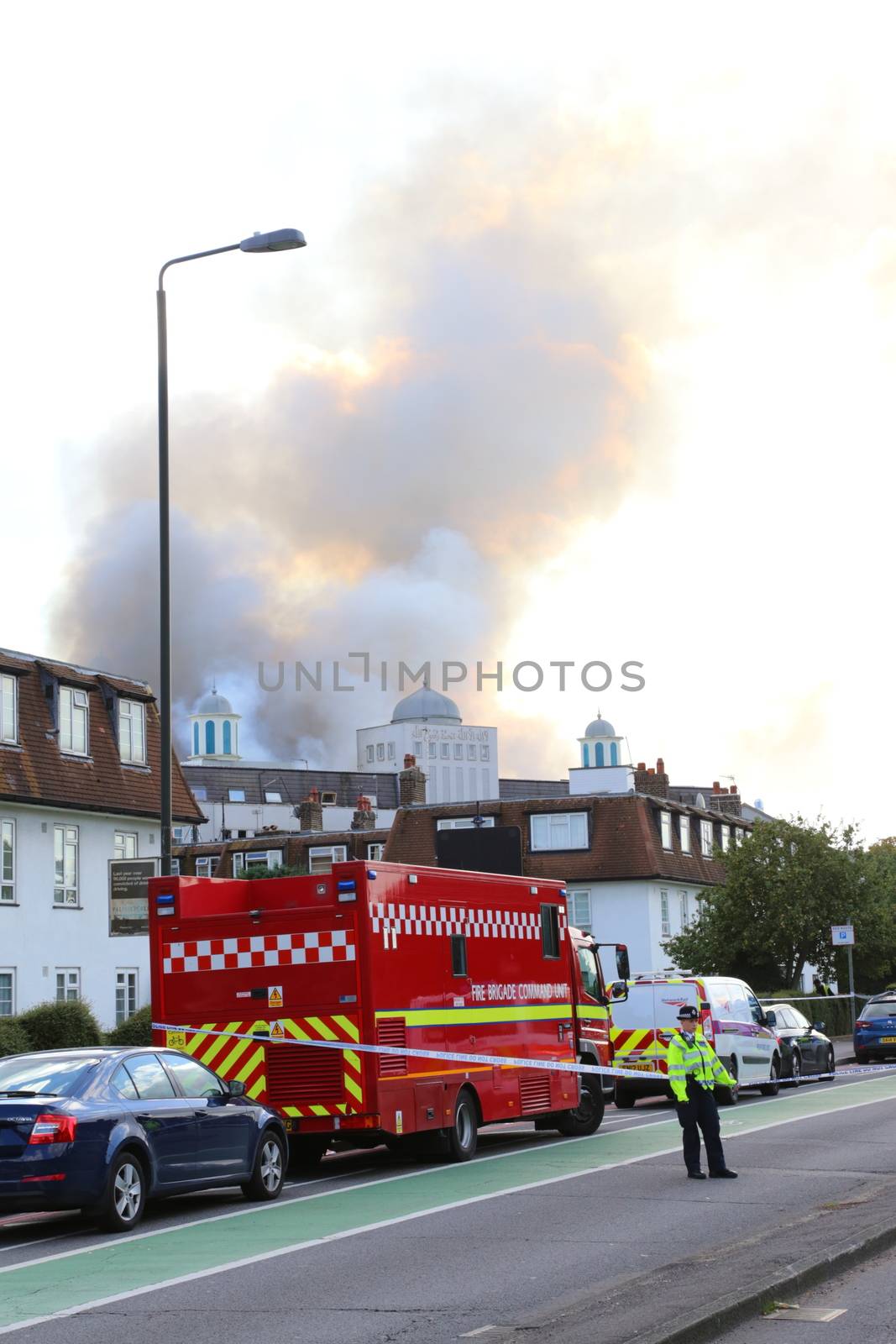 GREAT BRITAIN, London: Smoke rises from the Baitul Futuh Mosque in the Morden suburb of London, September 26, 2015.	The mosque, opened in 2003, is one of the biggest in western Europe and houses offices and a community centre. 