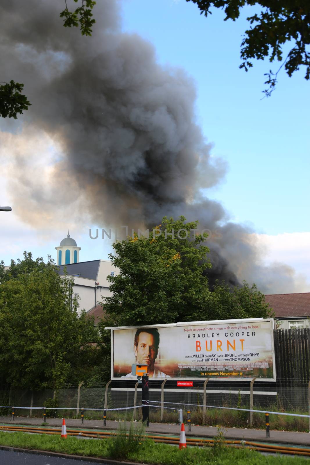 GREAT BRITAIN, London: Smoke rises from the Baitul Futuh Mosque in the Morden suburb of London, September 26, 2015.	The mosque, opened in 2003, is one of the biggest in western Europe and houses offices and a community centre. 