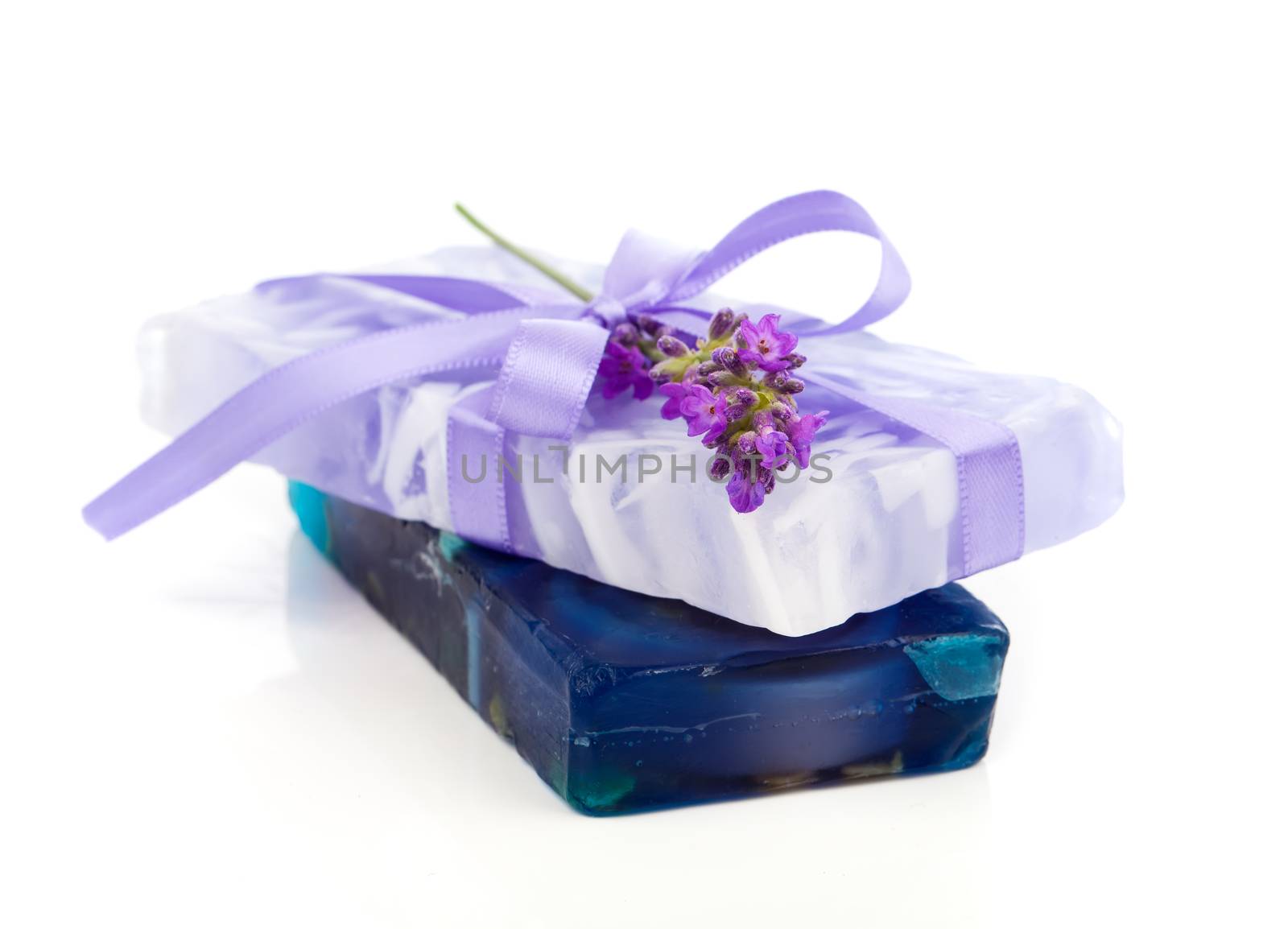 natural herbal lavender soap with fresh blossoms isolated on white background