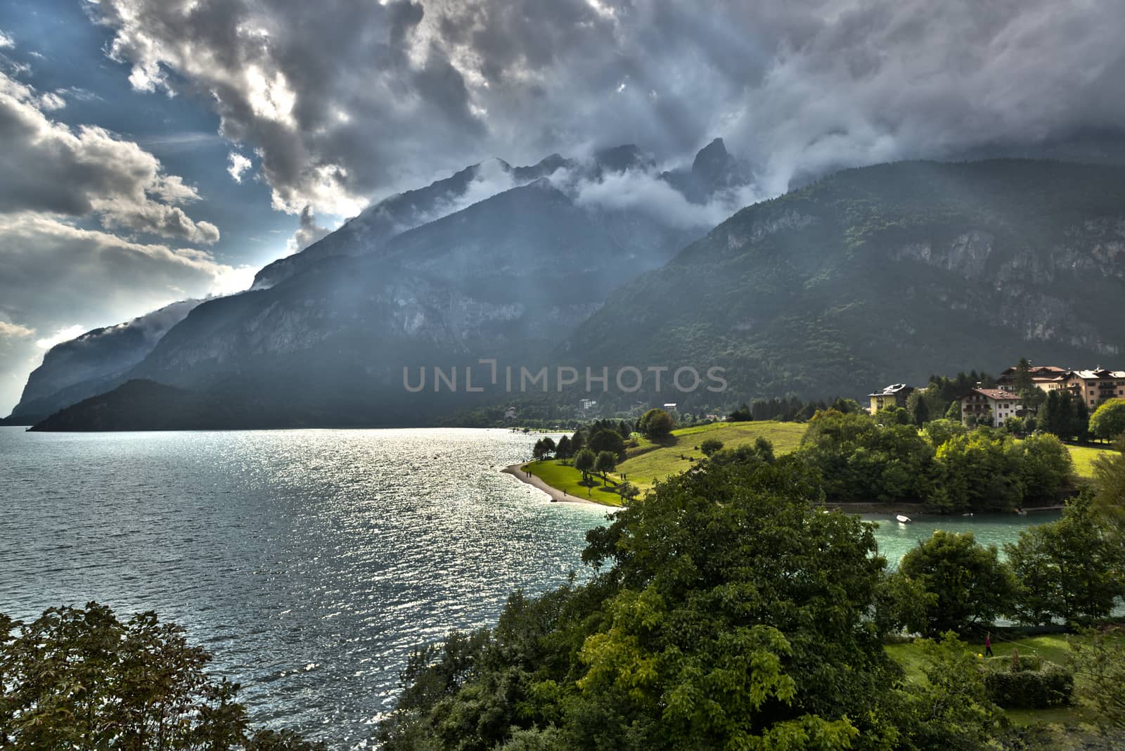 Cloudy sunset on the lake of Molveno in the summer season, Trentino - Dolomites, Italy