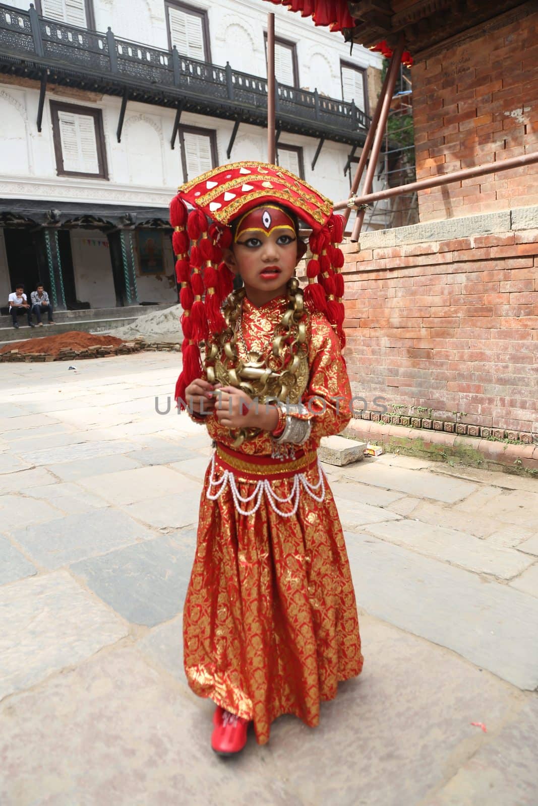 CORRECTION: Clarifies that Kumari-Puja is part of the Indra Jatra festival and not the Durga Puja festival.NEPAL, Kathmandu: A girl is prepped for the procession of Kumari Puja, as part of the Indra Jatra festival in Kathmandu, Nepal on September 26, 2015.