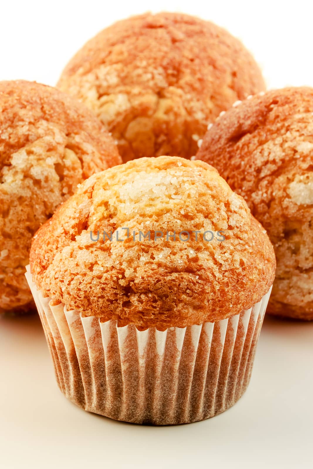 Homemade muffins on a white background. Vertical image.