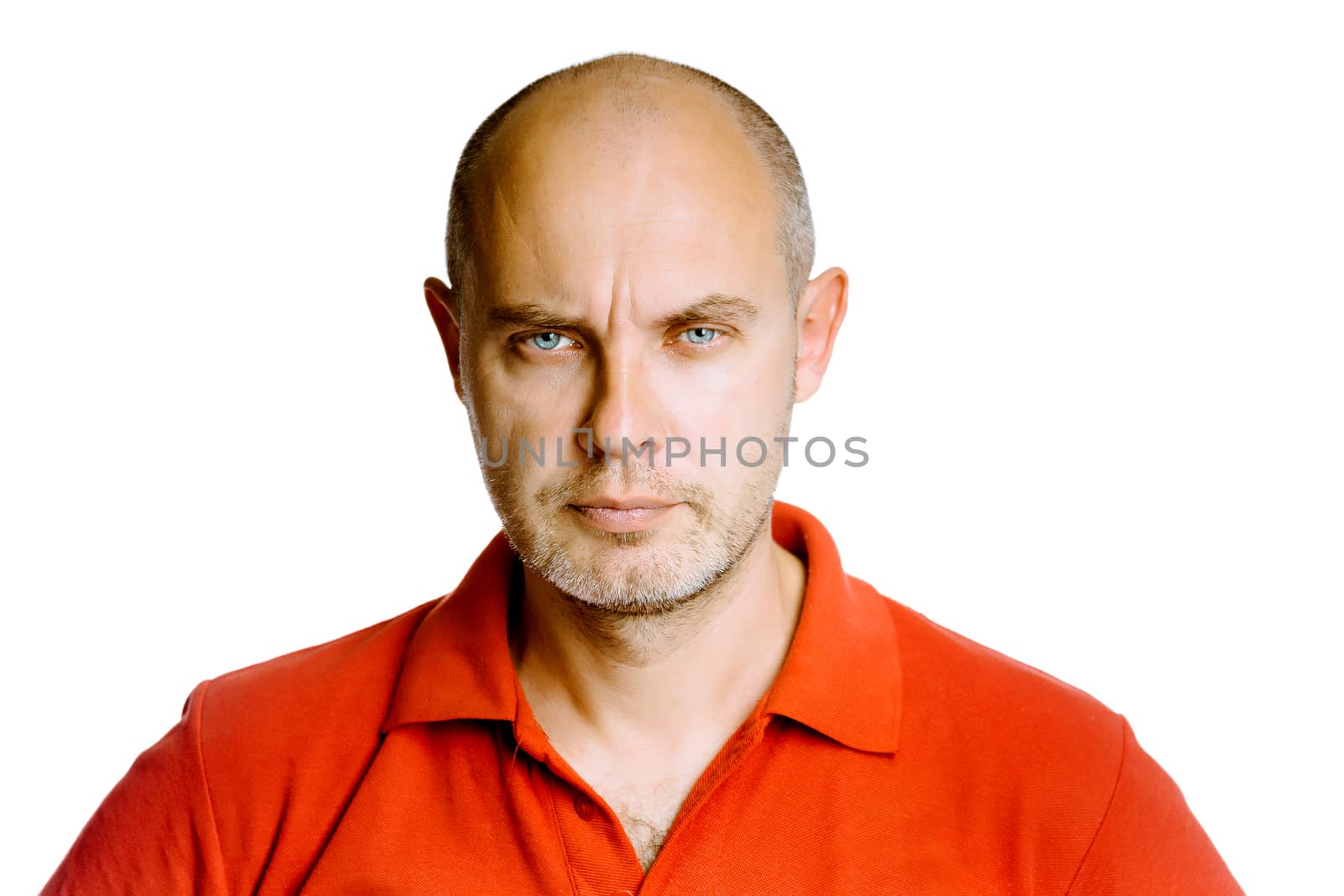 Unshaven fearsome blue eyes middle-aged man in a red T-shirt. Studio. isolated