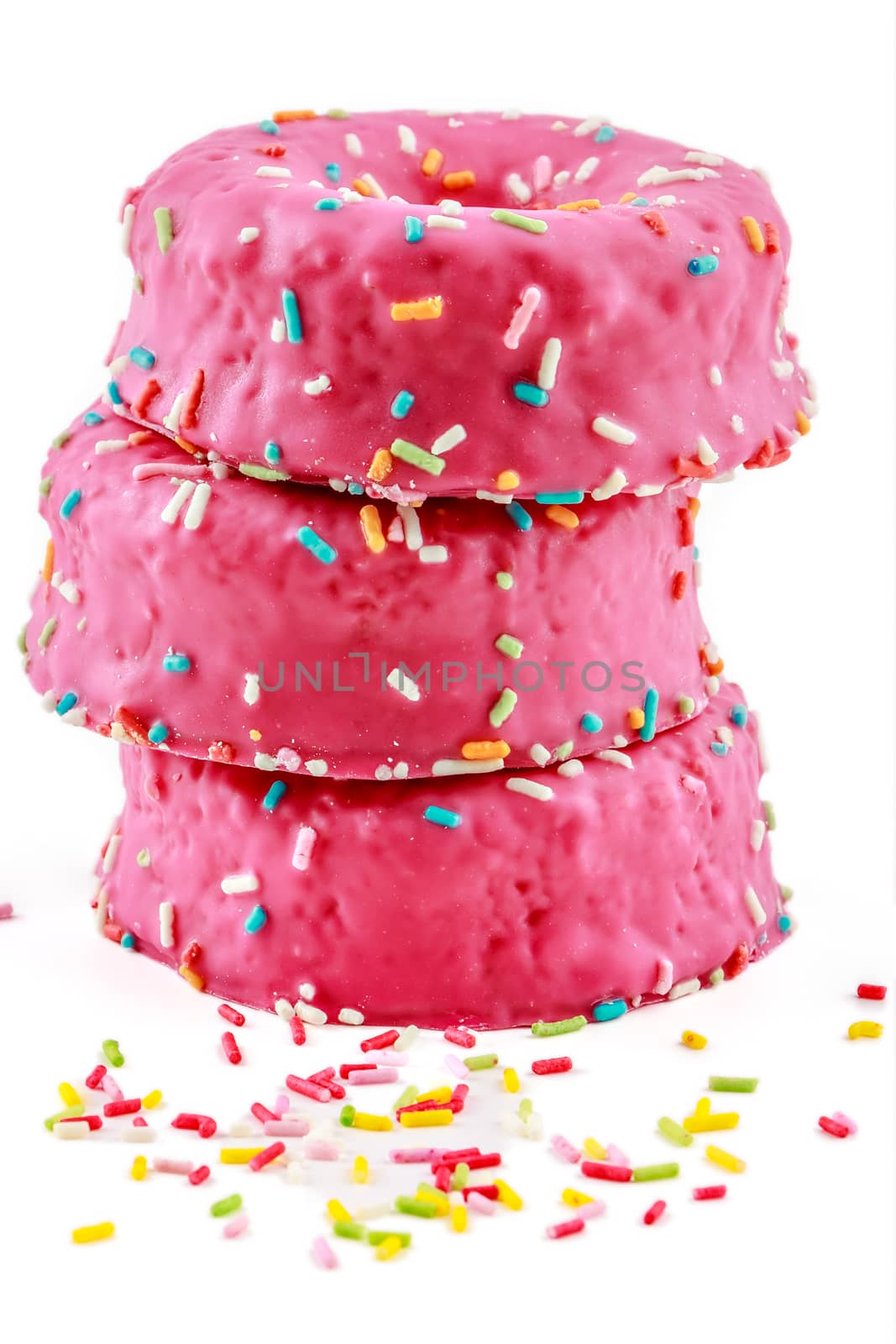 Strawberry donuts with chocolate shavings color on white background.Vertical image.