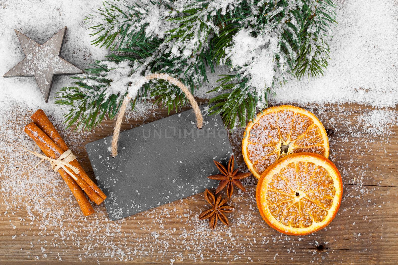 Christmas decoration with slate board, over wooden background