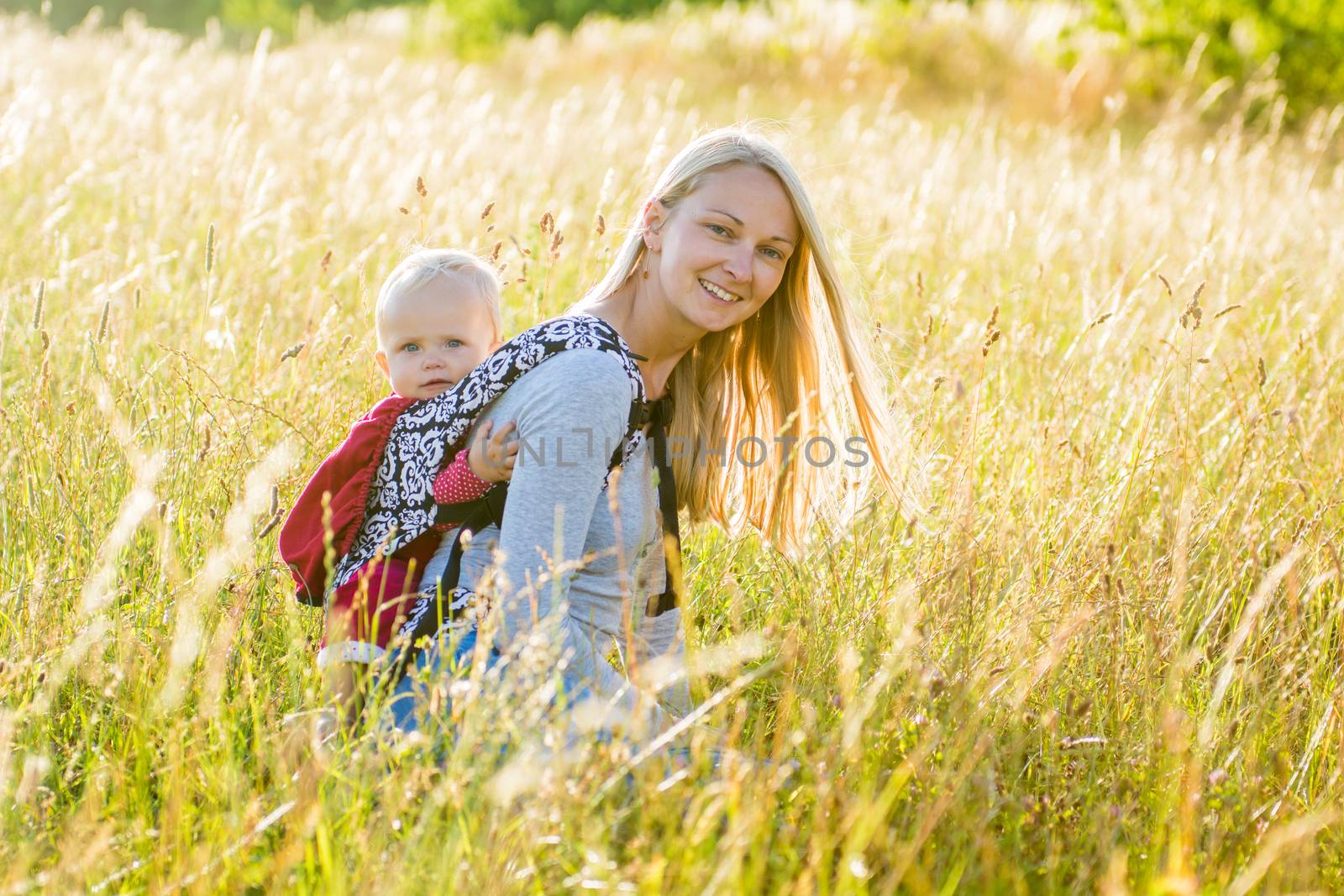 Mother, daughter in a meadow by kamsta
