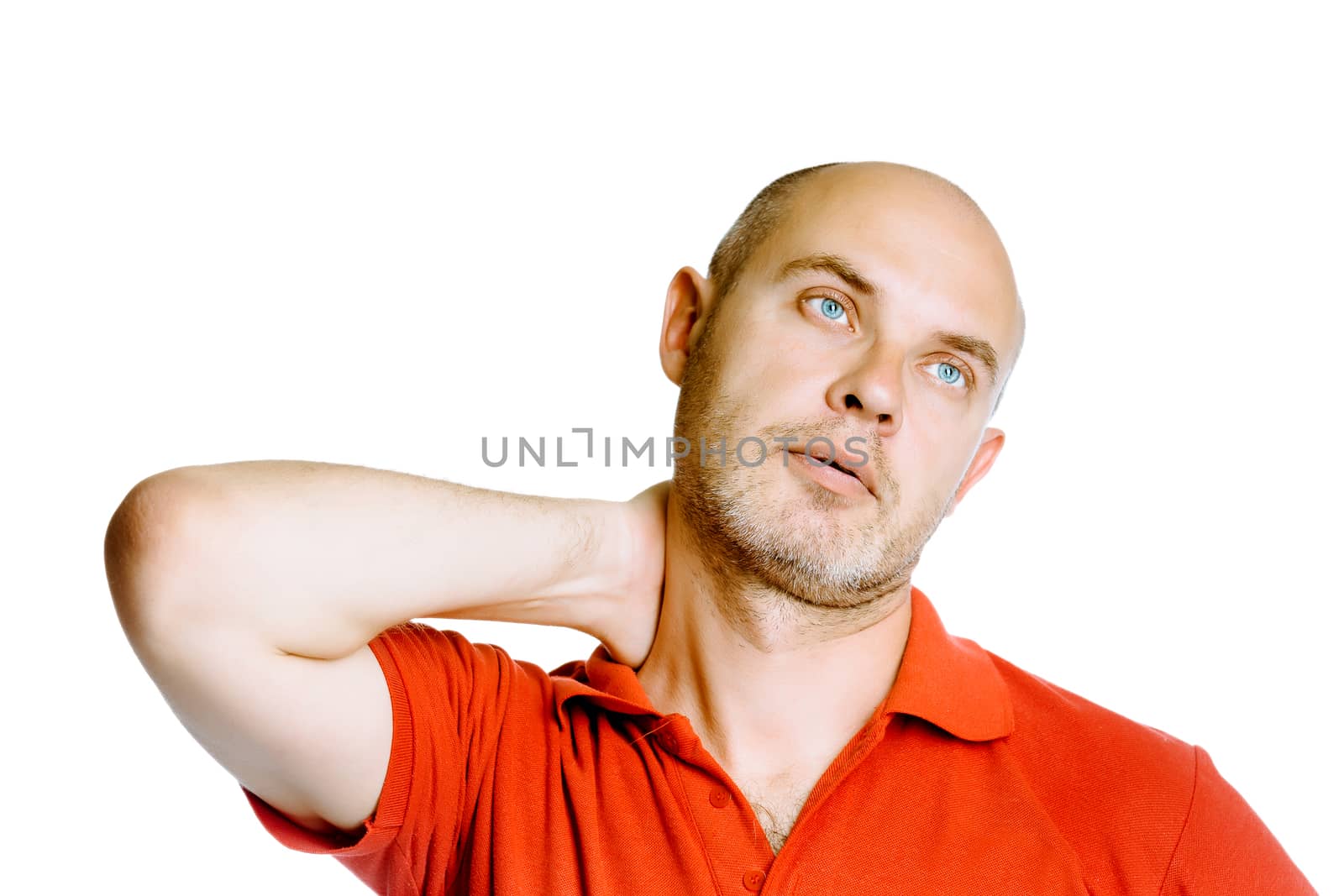 Unshaven blue eyed middle-aged man holding his neck. Pain. Studio. isolated