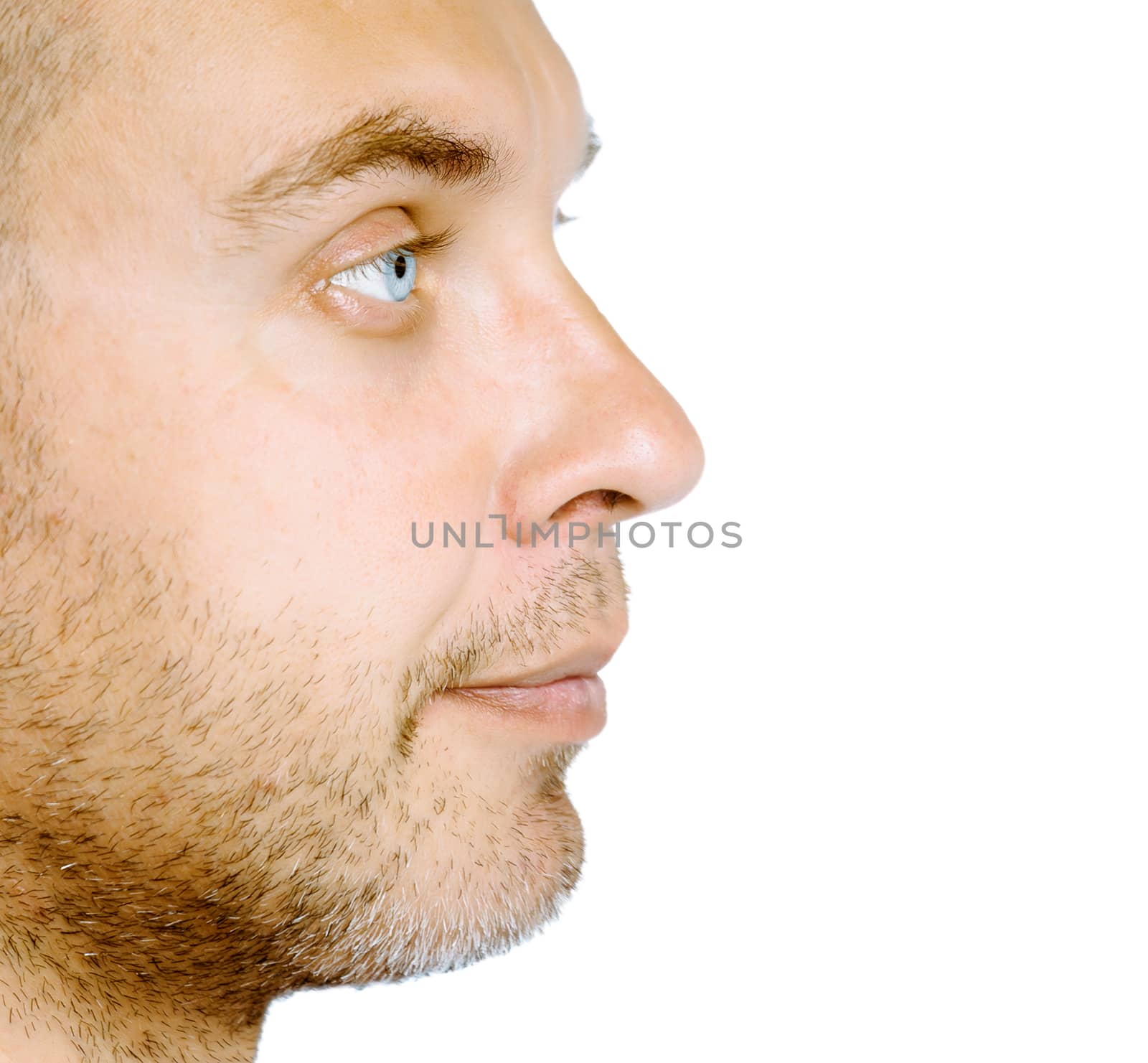 Unshaven blue eyed middle-aged man in profile. Studio. isolated