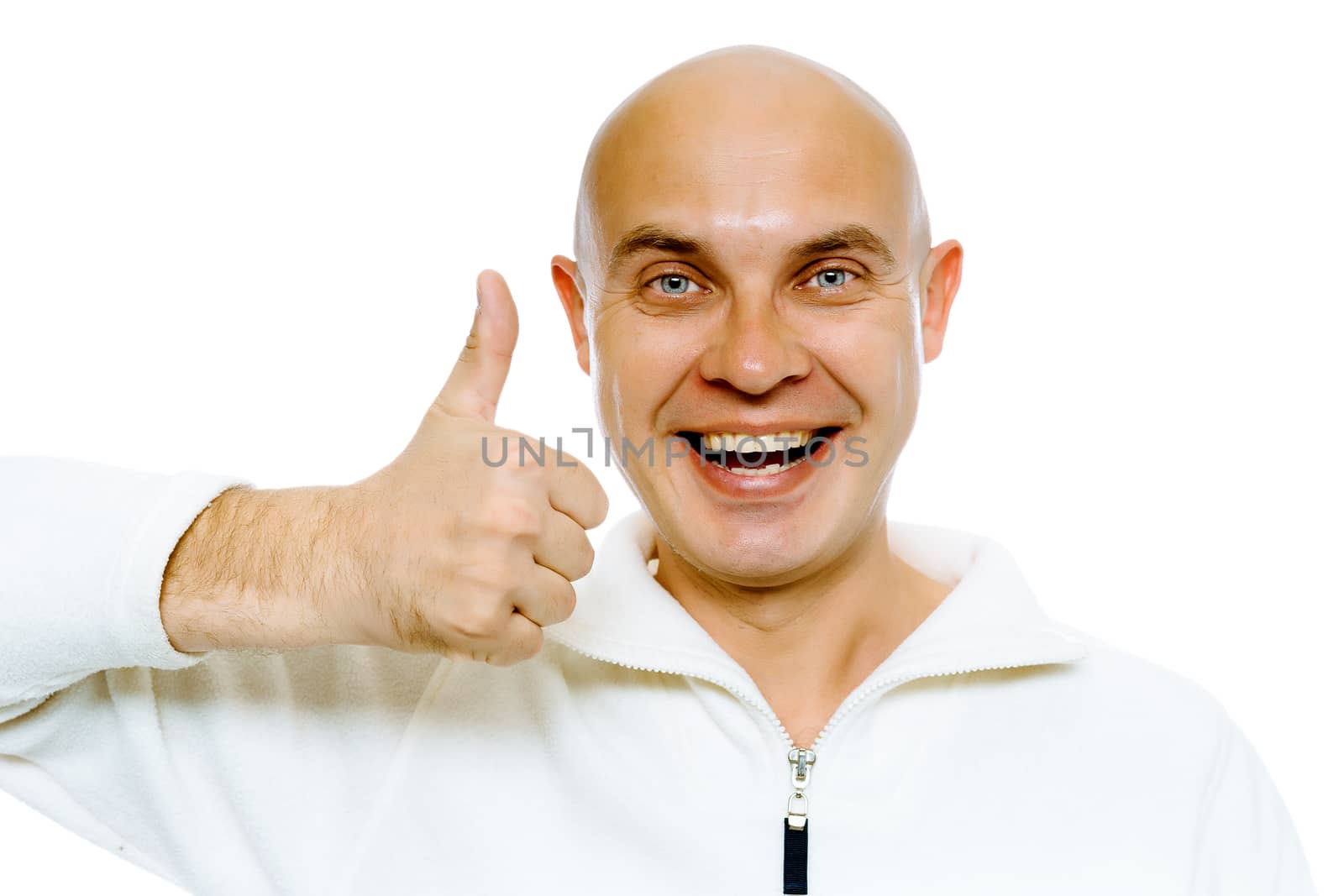Bald smiling blue-eyed man in a white jacket with thumb up. Studio. isolated