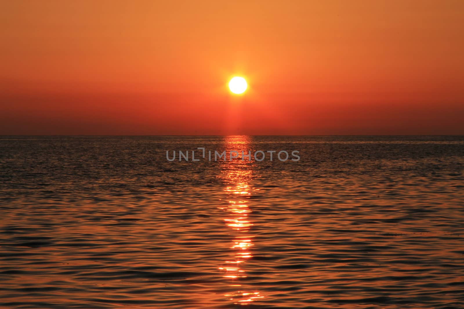 Sunset over the Black sea and summertime beach