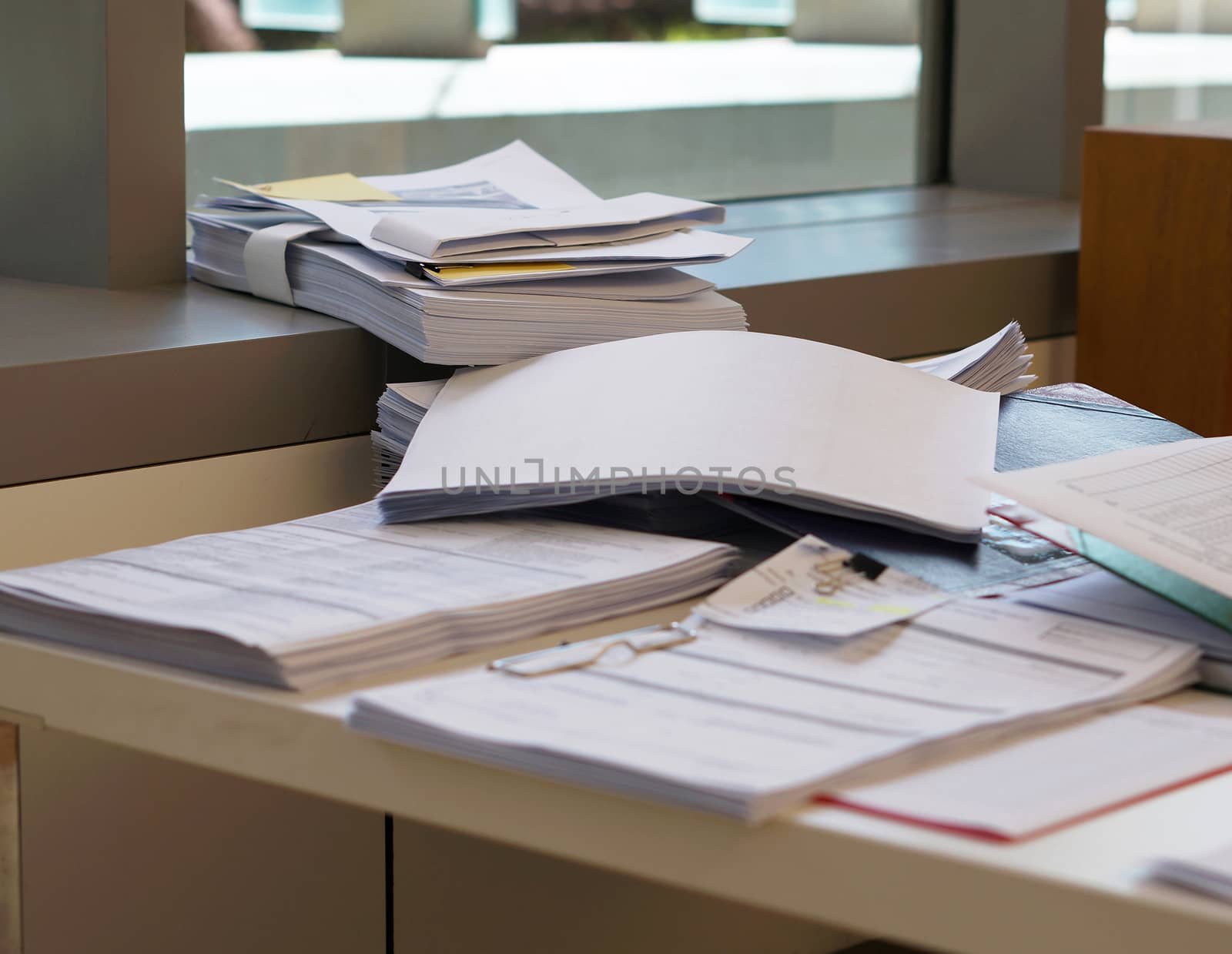 Pile of document on desk at office by ninun