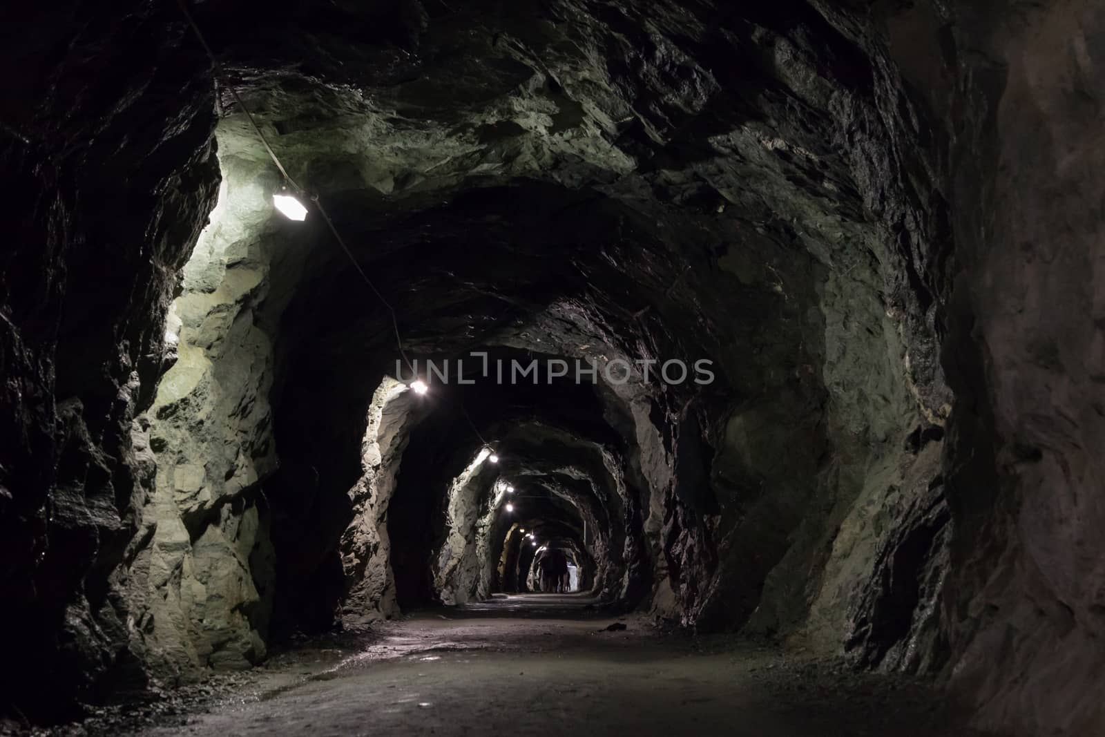Small dark tunnel in a Swiss mountain