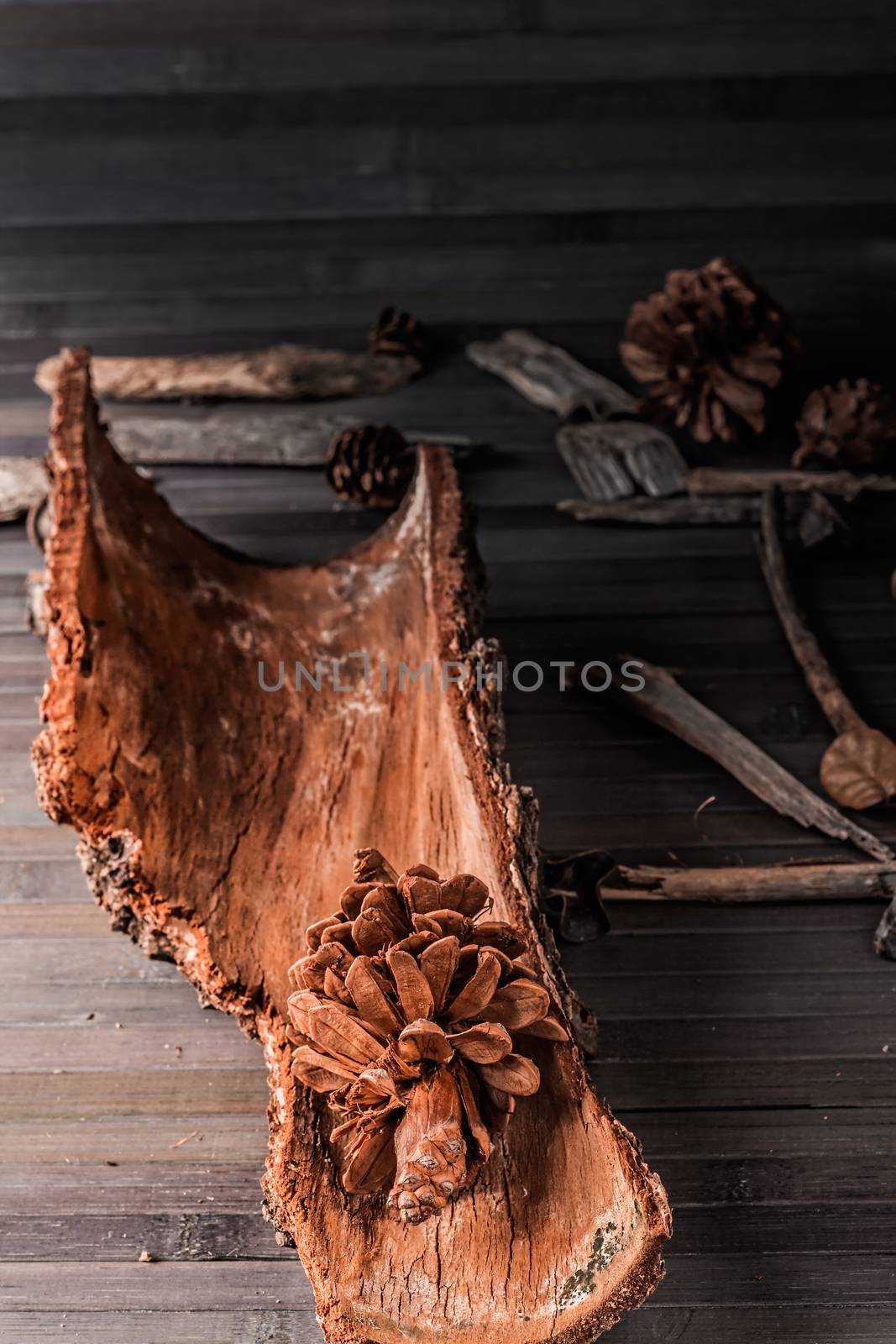 Pinecone with rustic decor in a wooden table.Vertical image.