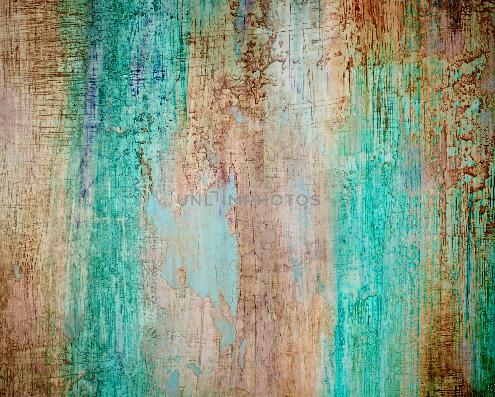 Turquoise, Brown and Green Obsolete Cracked Cement Wall Background closeup