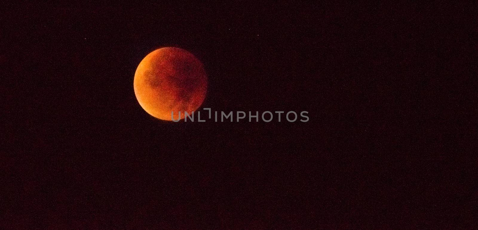 FRANCE, Douai : The supermoon rises on September 28, 2015 in Douai, northern France. This is a rare astronomical event when a swollen supermoon and lunar eclipse combined for the first time in decades, showing the satellite bathed in blood-red light.