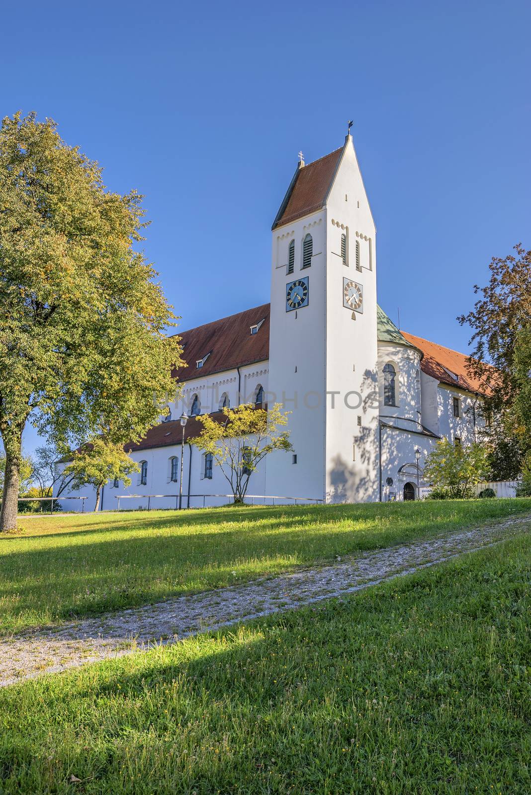 Image of monastery Thierhaupten in Bavaria, Germany in summer with blue sky and grean meadow