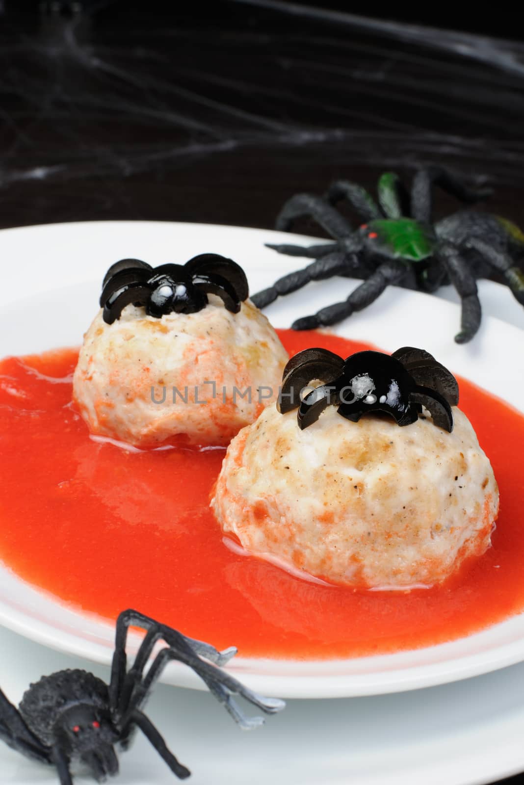 chicken meatballs in tomato gravy on the table in honor of Halloween