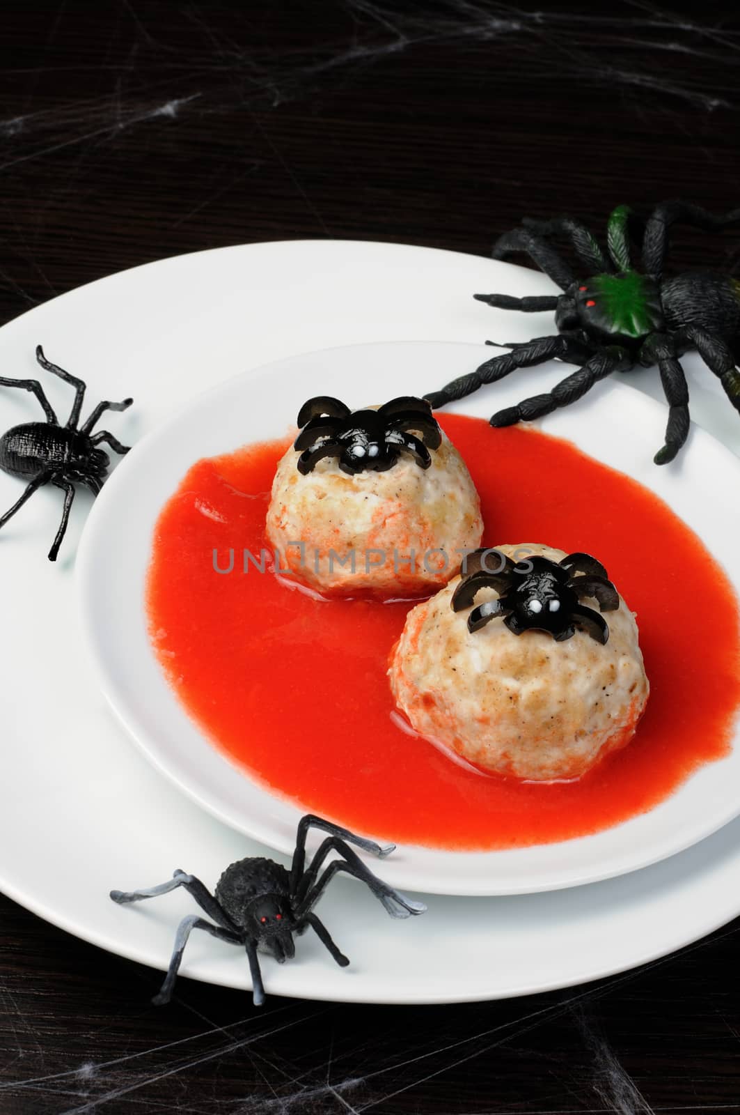 chicken meatballs in tomato gravy on the table in honor of Halloween