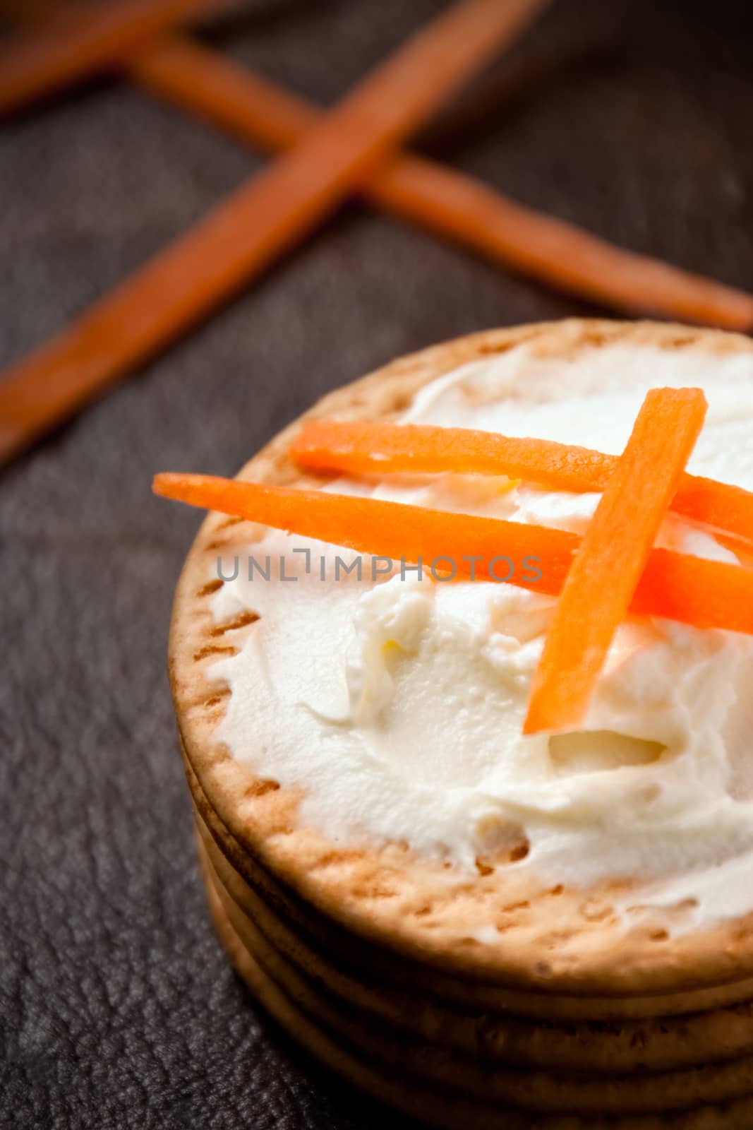 Cookies with cream cheese and strips of carrot