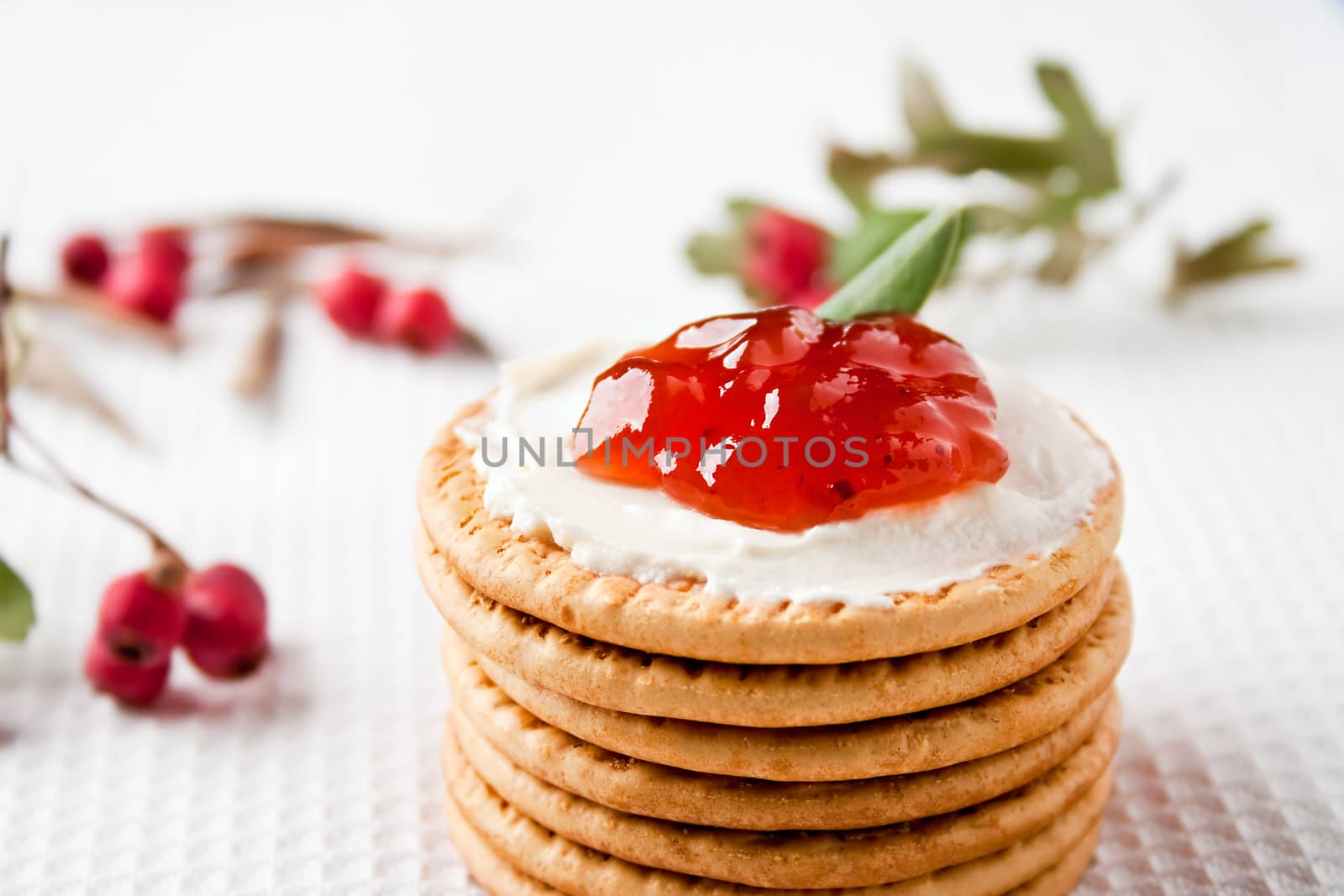 Cookies with cream cheese, strawberry jam and cranberries around