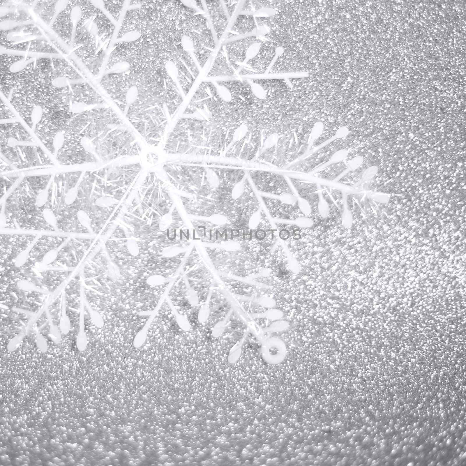 Beautiful decorative christmas snowflake over silver glitter background