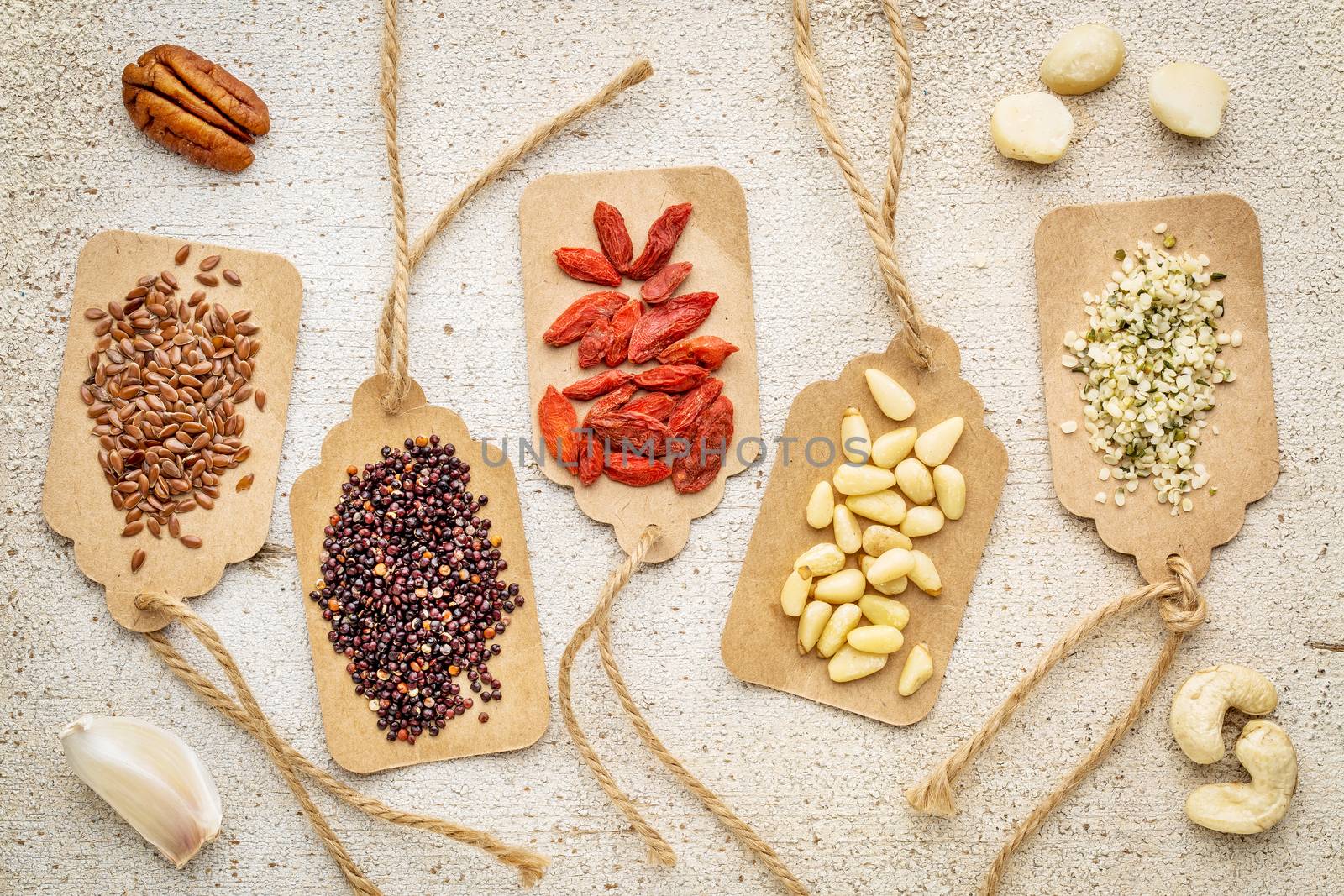 berries, nuts, grains and seeds - superfood abstract by PixelsAway