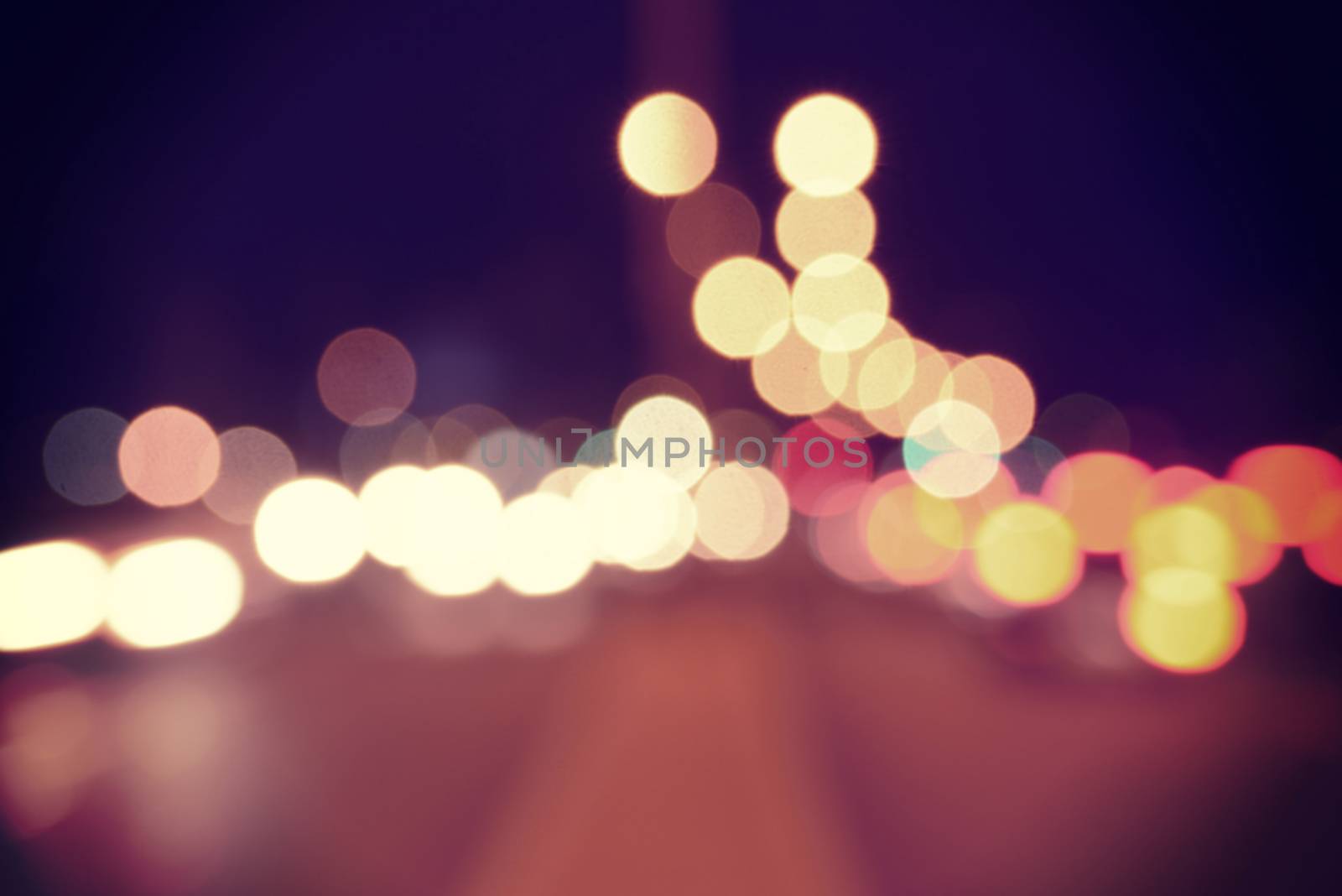  Blur urban car lights bokeh background with vintage filter effect.