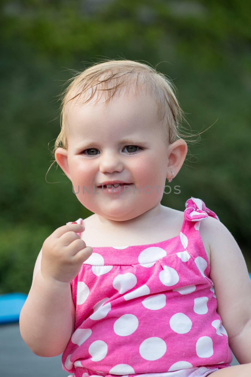 Happy cute little girl outdoor by artush