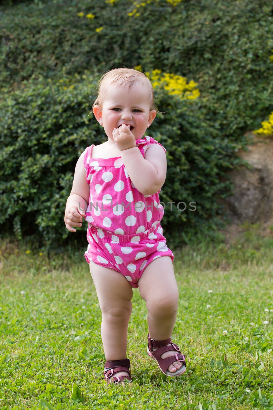 Happy cute little girl outdoor by artush