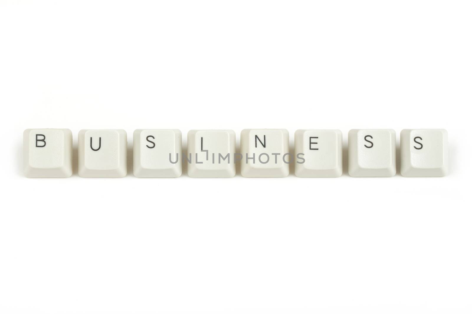 busines text from scattered keyboard keys isolated on white background
