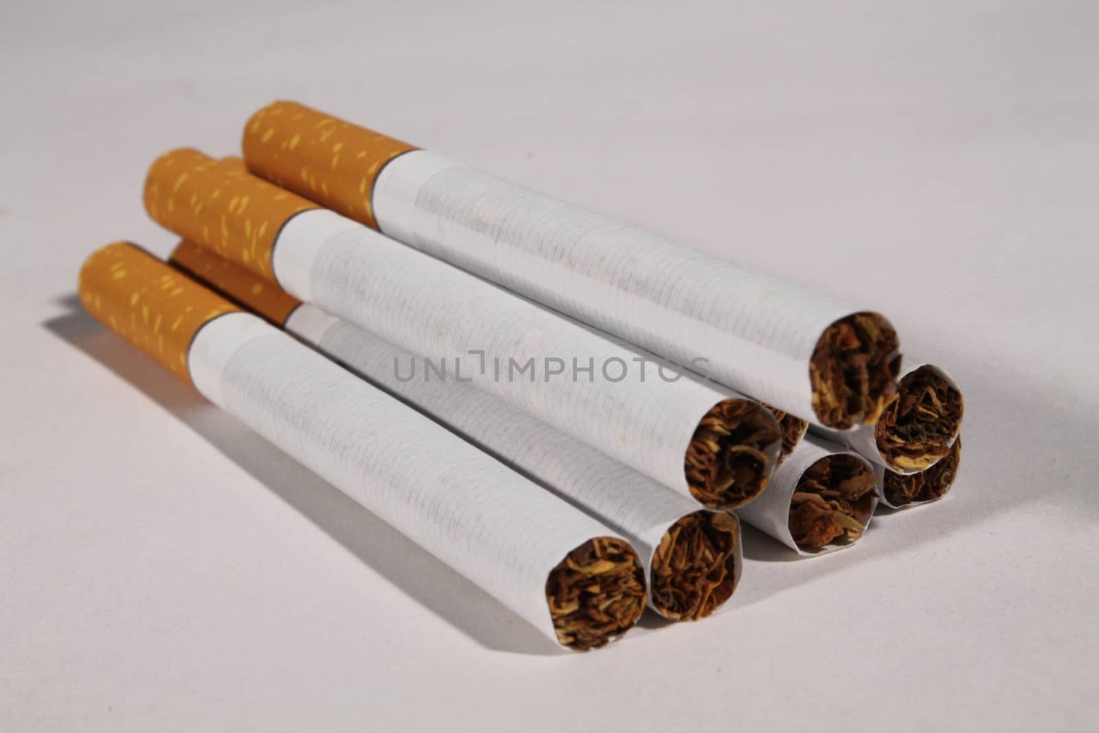 group of cigarettes on white background by diecidodici