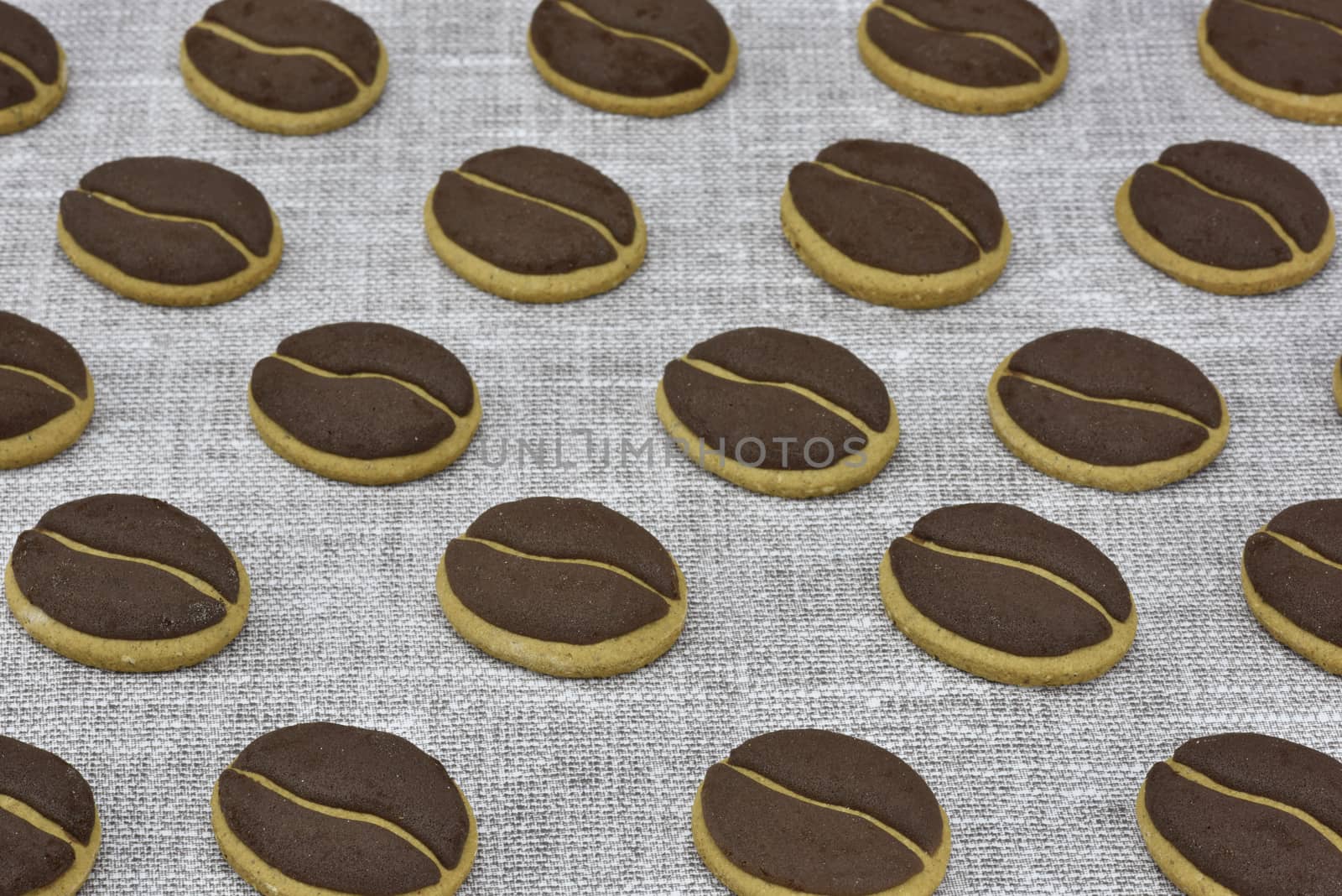 Delicious coffee cookies arranged on a tablecloth