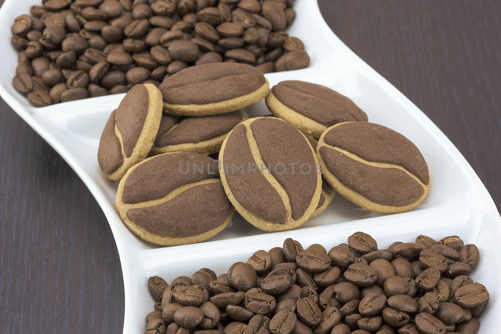 Delicious coffee cookies with coffee beans on a corrugated tray