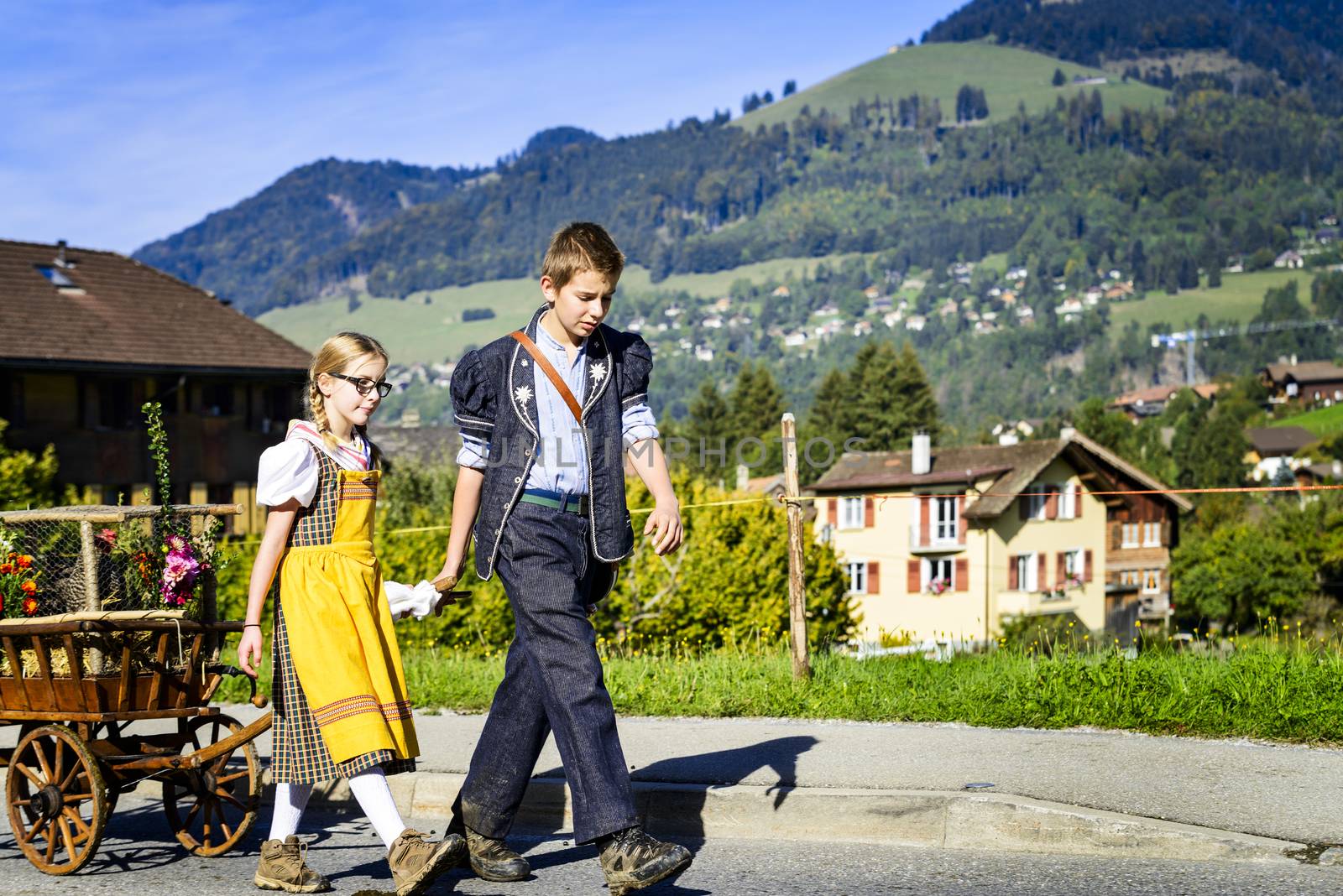 Charmey, Fribourg, Switzerland - 26 September 2015 : Farmers with a herd of cows on the annual transhumance at Charmey near Gruyeres, Fribourg zone on the Swiss alps