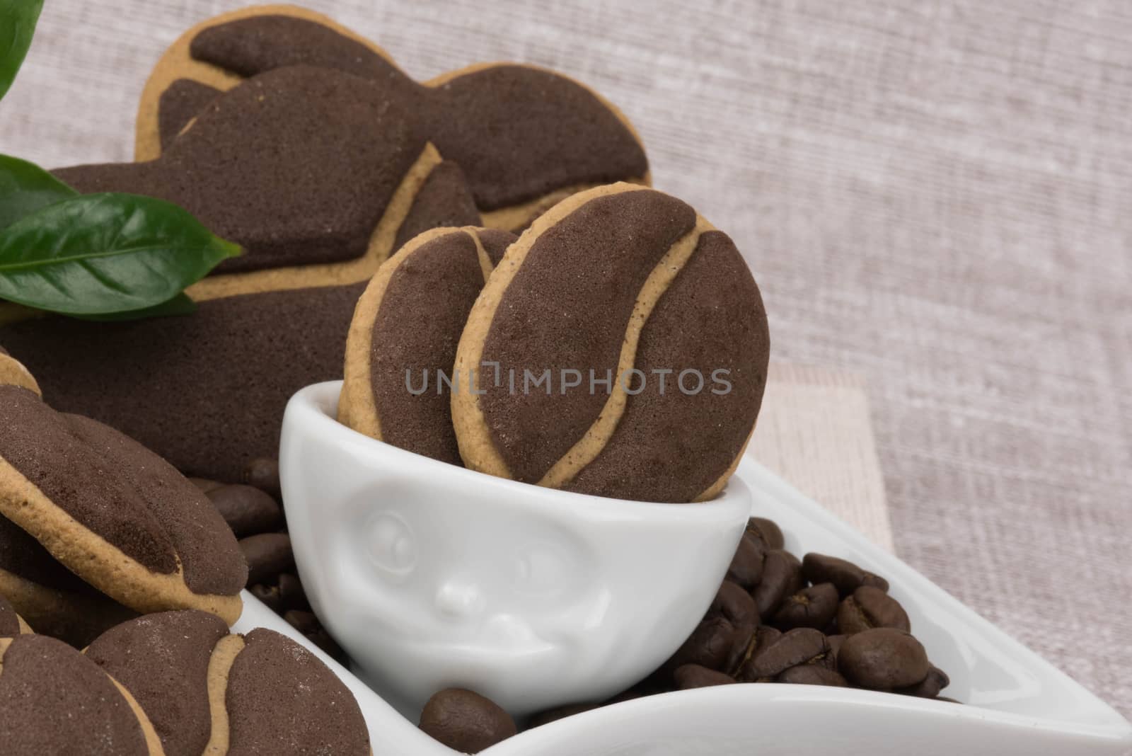 Delicious coffee cookies  in a cute cup with facial expressions