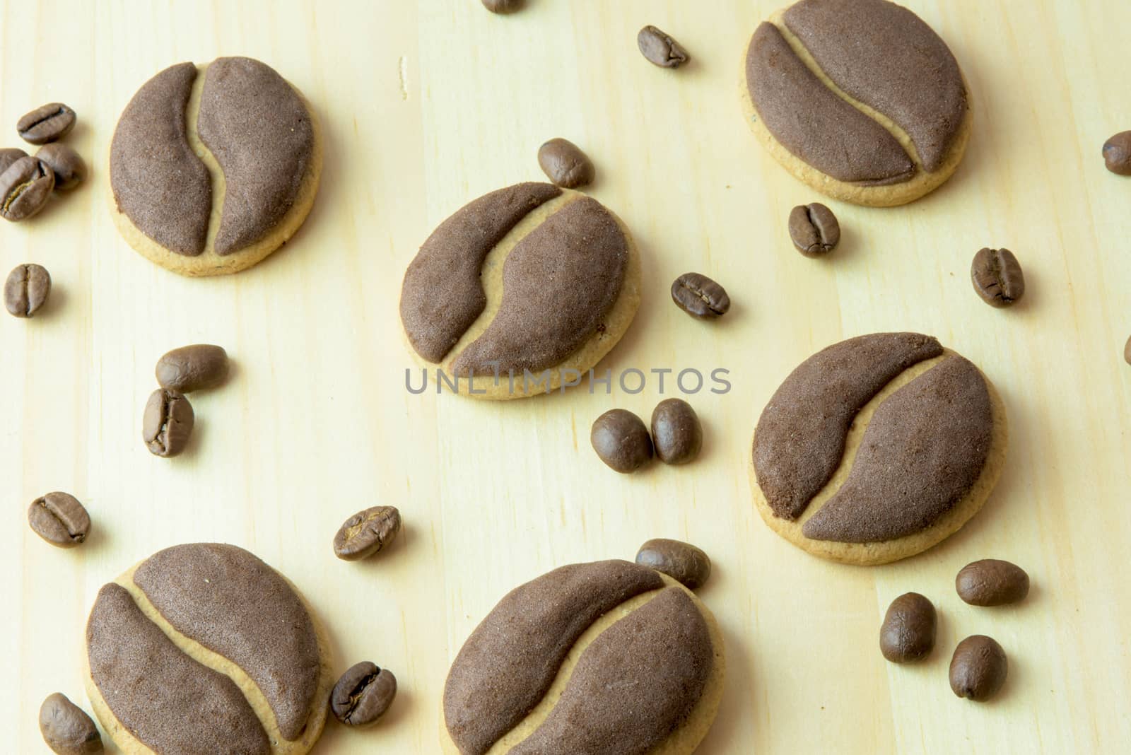 Delicious coffee cookies arranged on a wooden tray