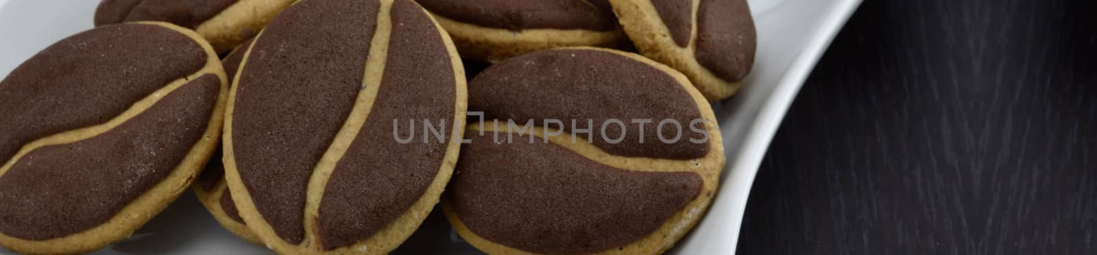 Delicious coffee cookies with coffee beans on a corrugated tray