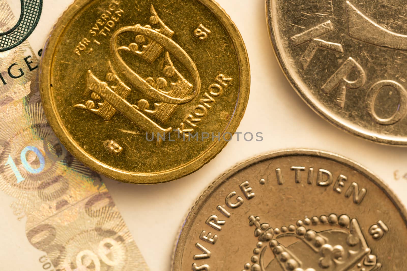 Swedish Currency Close Up. 100 bank notes, and a 10, 5 and 1 krona coin.