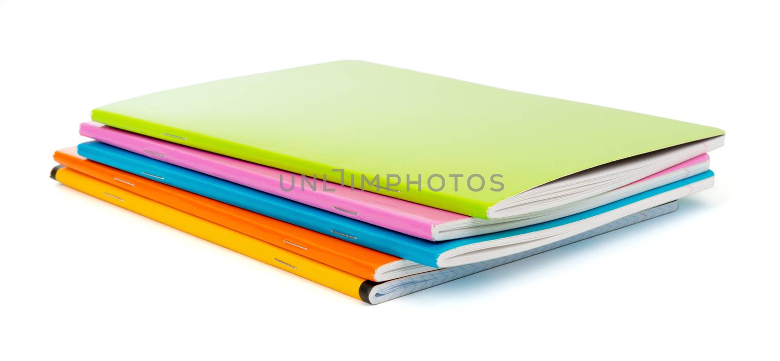 Pile of colorful copybooks on isolated white background