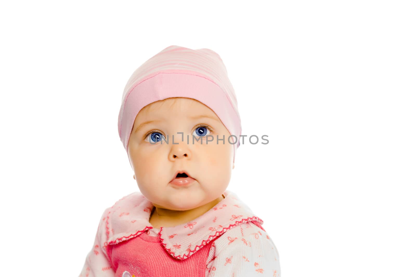 Cute baby girl in a pink dress and hat. Portrait. Studio. Isolated.