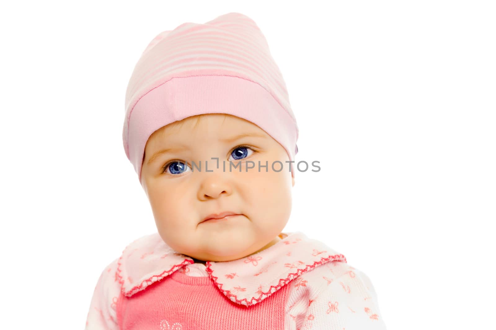 Cute baby girl in a pink dress and hat. Portrait. Studio. Isolated.