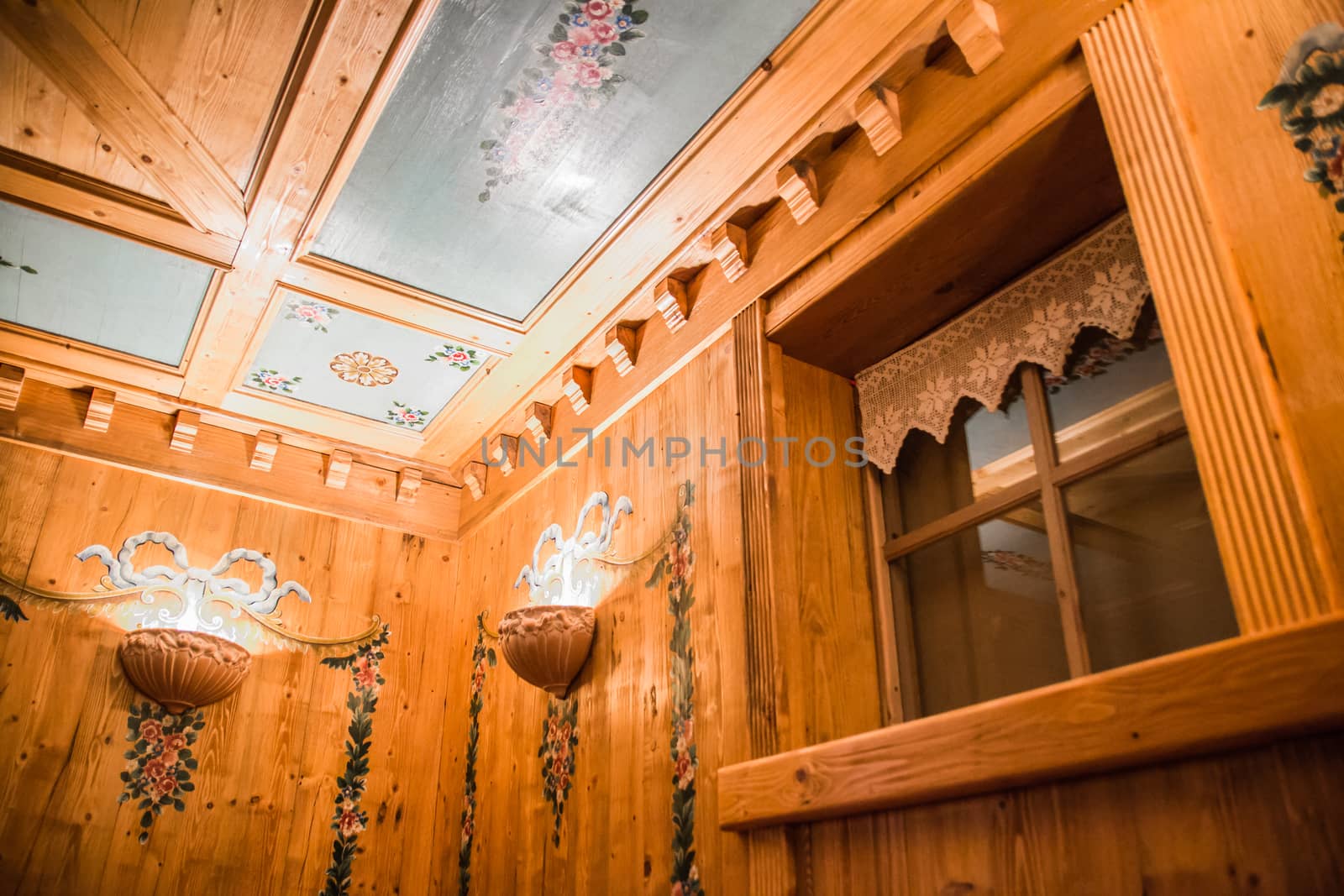 painted wooden ceiling with window