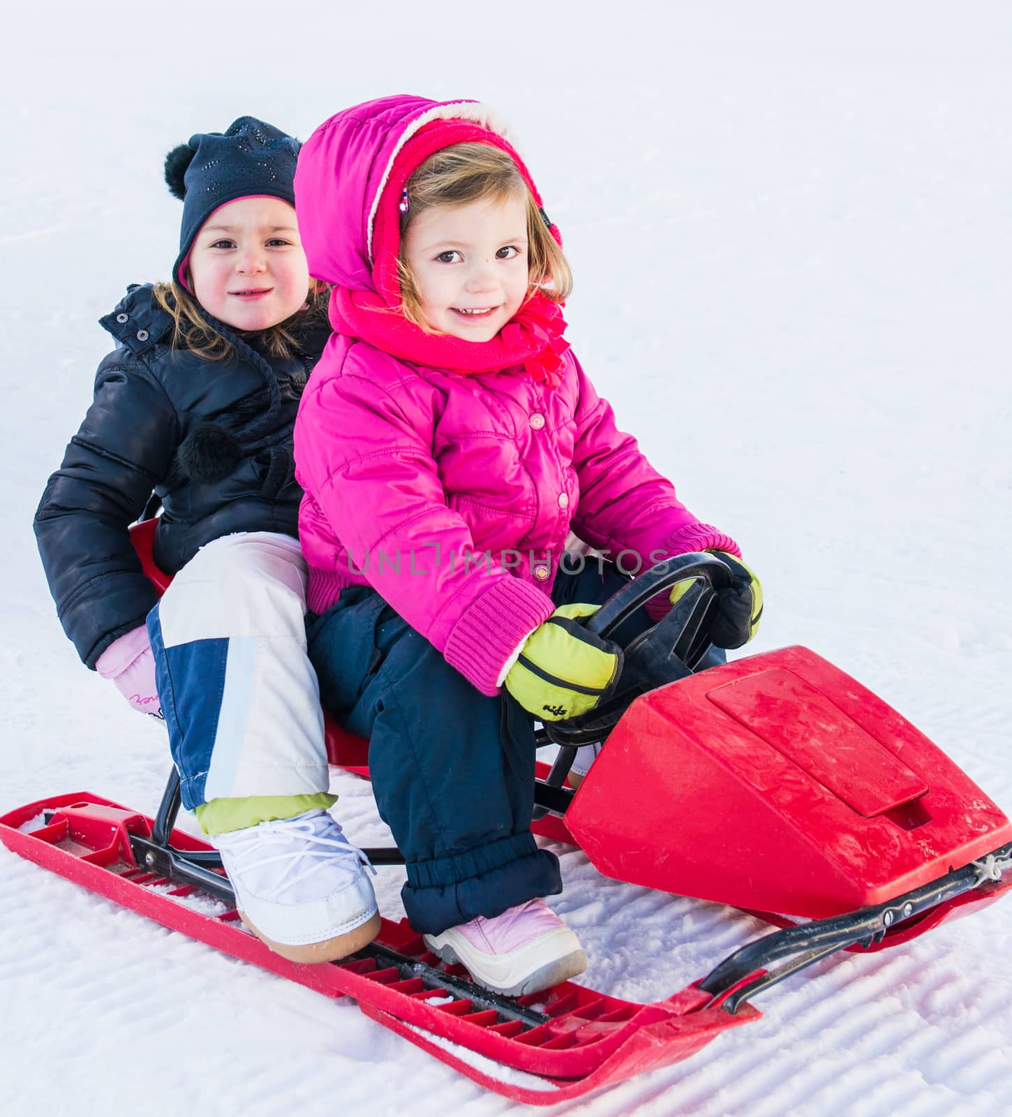 little girls on toboggan by Isaac74