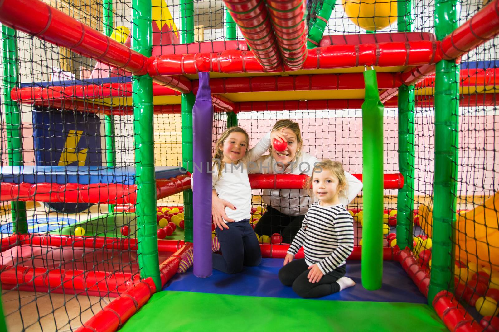 Family into indoor playroom