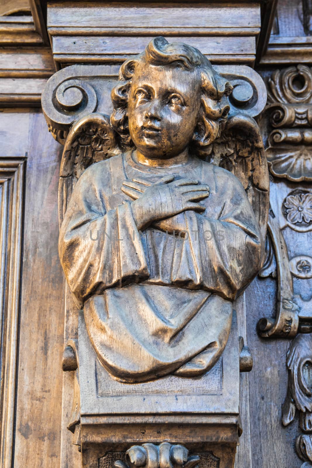 angel carved in a wood portal