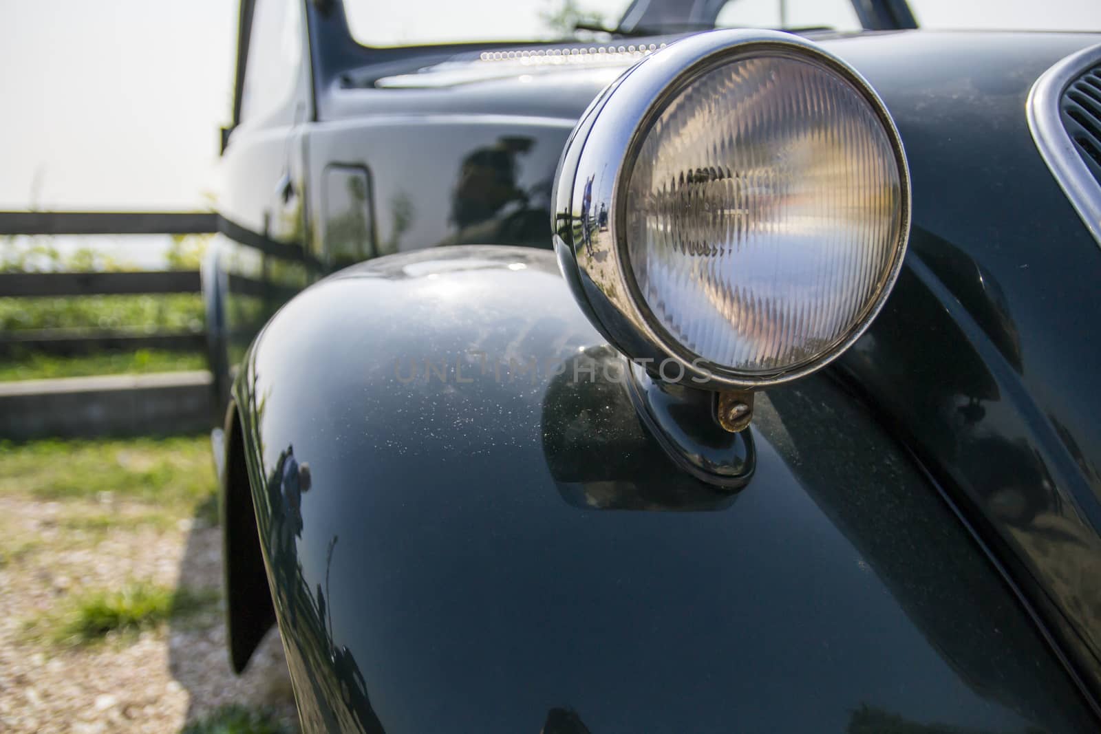 old headlight of black vintage car